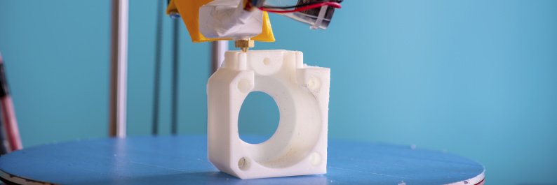 3D printing (subtractive manufacturing) a white plastic part
